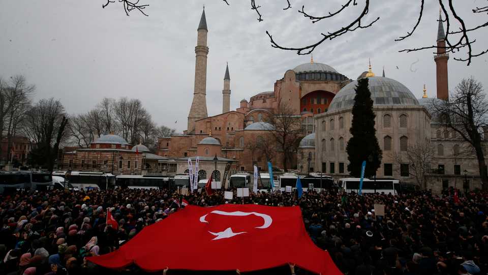 Backdropped by Hagia Sophia, a Byzantine-era cathedral that was turned into a mosque and now serves as a museum, demonstrators protest against the mosque attacks in New Zealand, in Istanbul, Saturday, March 16, 2019.