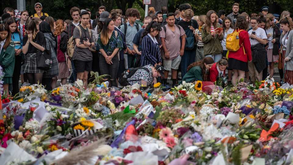 Mourners and well-wishers place flowers and tributes near the Al Noor mosque on March 18, 2019 in Christchurch, New Zealand. 50 people were killed and dozens were wounded in a terrorist attack on two mosques in the New Zealand city on Friday, March 15, 2019.