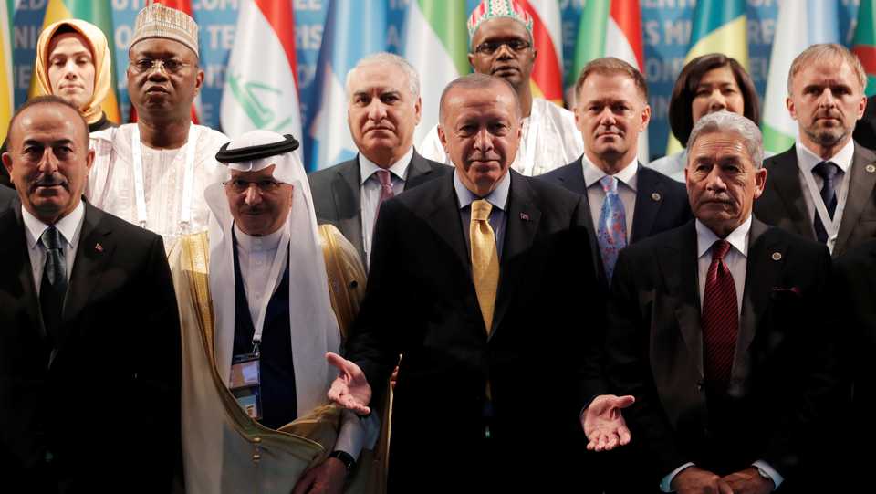 Turkish President Recep Tayyip Erdogan poses for a group photo with Secretary General of OIC Yousef bin Ahmad Al-Othaimeen, New Zealand's Foreign Minister Winston Peters and Turkish Foreign Minister Mevlut Cavusoglu during an emergency meeting of the Organisation of Islamic Cooperation (OIC) in Istanbul, Turkey, March 22, 2019.