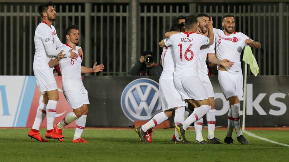 Turkey's Burak Yilmaz celebrates with team mates after scoring their first goal at Loro Borici Stadium, Shkoder, Albania .