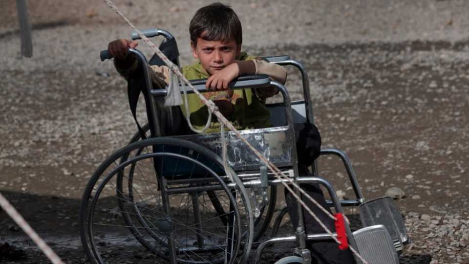 A Syrian boy in a wheelchair at a refugee camp in Islahiye, Turkey.