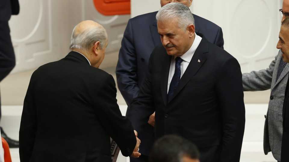 MHP leader Devlet Bahceli and Turkish Prime Minister Binali Yildirim shook hands over the constitutional amendments.