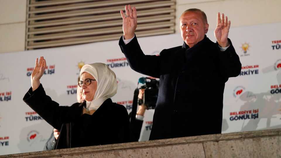Turkish President Tayyip Erdogan and his wife Emine greet supporters in Ankara, Turkey April 1, 2019.