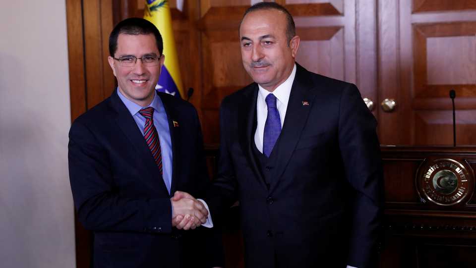 Turkish Foreign Minister Mevlut Cavusoglu (R) shakes hands with his Venezuelan counterpart Jorge Arreaza after a press conference in Ankara, Turkey. April 1, 2019.