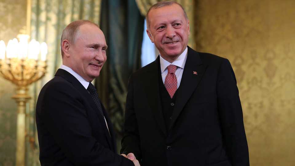 Turkey's President Recep Tayyip Erdogan [R] shakes hands with his Russian counterpart Vladimir Putin during their meeting in the Kremlin in Moscow, Russia, on April 8, 2019.