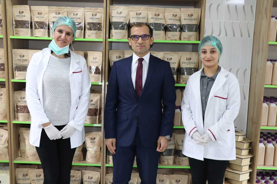 Cukurca District Governor Temel Ayca has developed the Zap project to commercialise the district's agricultural products. He poses with Zap sellers in Cukurca, Hakkari on April 4, 2019.