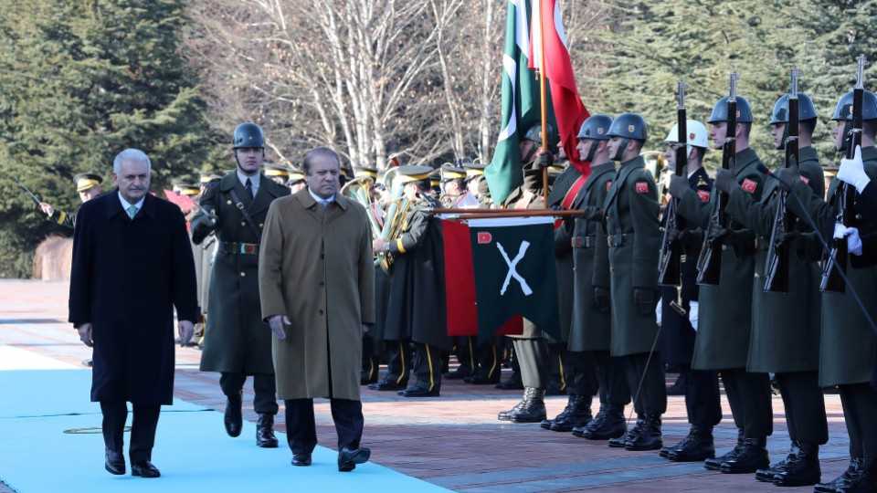 Turkish Prime Minister Binali Yildirim and his Pakistani counterpart Nawaz Sharif review a guard of honour during a welcoming ceremony in Ankara, Turkey, February 23, 2017.