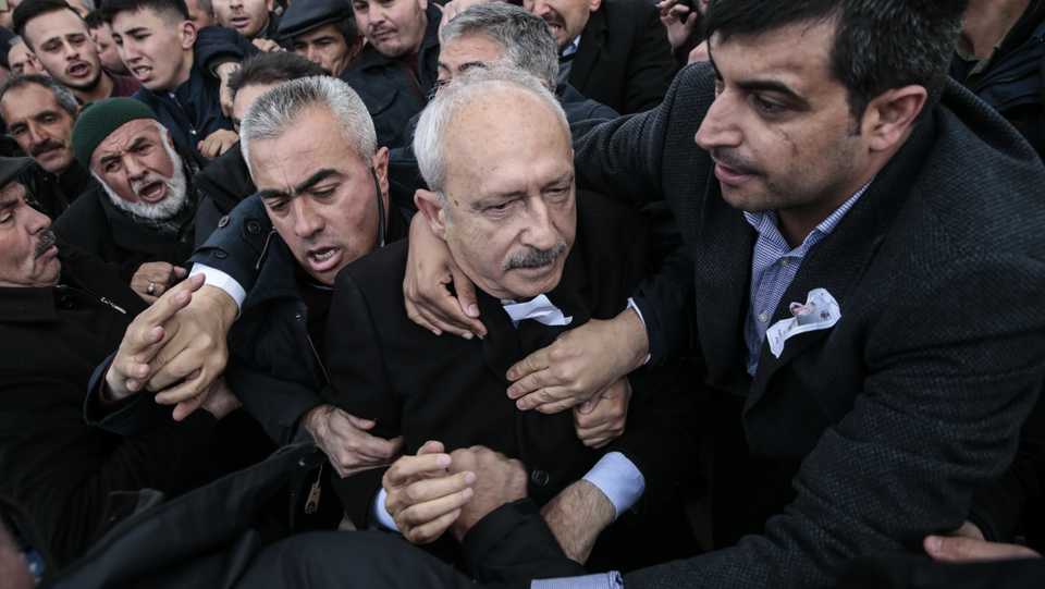 Chairman of the Republican People's Party (CHP) Kemal Kilicdaroglu (C) is seen being attacked during the funeral in Ankara on April 21 of Yener Kirikci, a soldier who died in a military operation against PKK terrorists.