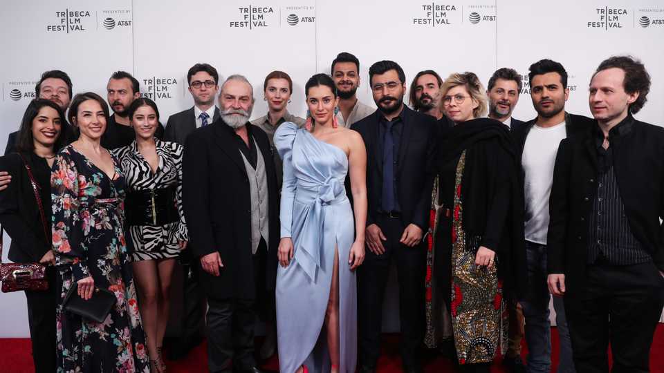 Director Cenk Erturk (R6), Actor Ali Atay (L4), Actor Arin Kusaksizoglu (L2), Actor Haluk Bilginer (L7), Actress Hande Dogandemir (R7), Producer Alp Erturk, Producer Tuna Erturk(R2), Producer Patrick Mares (R3), Turkish Consul General in New York Alper Aktas (L6) attend the 2019 Tribeca Film Festival World premiere of the