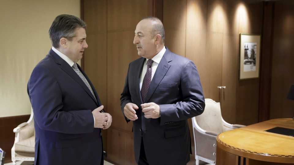 German Foreign Minister Sigmar Gabriel (L) meets Turkish Foreign Minister Mevlut Cavusoglu at the Adlon hotel in Berlin, Germany on March 8, 2017.