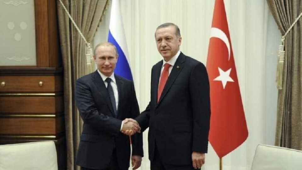Russia's President Vladimir Putin (L) shakes hands with his Turkish counterpart Tayyip Erdogan during a meeting at the Presidential Palace in Ankara, December 1, 2014 in this file photo.