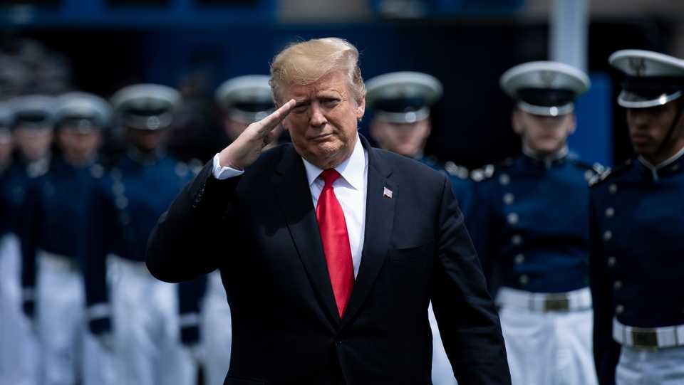 US President Donald Trump salutes as he arrives for the 2019 graduation ceremony at the United States Air Force Academy May 30, 2019, in Colorado Springs, Colorado.