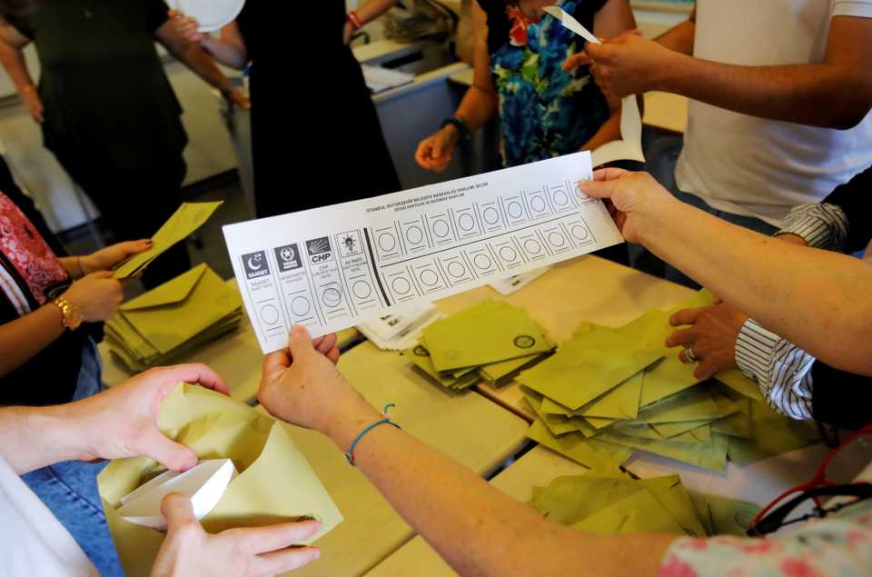 Election officials count votes at a polling station in Istanbul, Turkey, June 23, 2019.