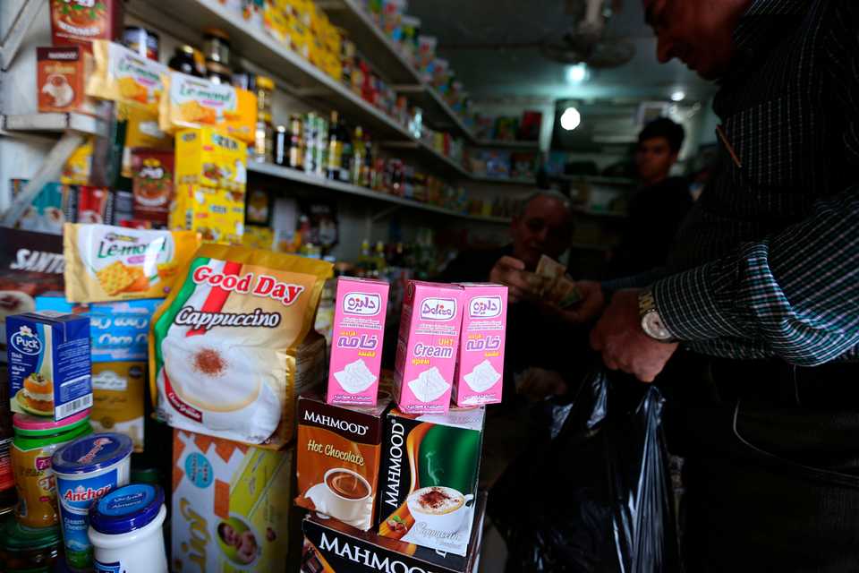 Iranian made food products are on display in Shurja market in central Baghdad, Iraq, Saturday, March 16, 2019. Iraq, once an enemy of Iran and battling a devastating eight-year war, is now a vital trading partner and a market for its commercial goods.