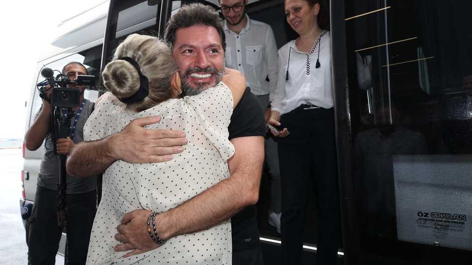 Former Halk Bank executive vice president Mehmet Hakan Atilla, found guilty in a violation of Iran sanctions case in the US and released from prison on Friday morning, arrived at Istanbul Airport. Atilla was welcomed by his mother Ayse Atilla.