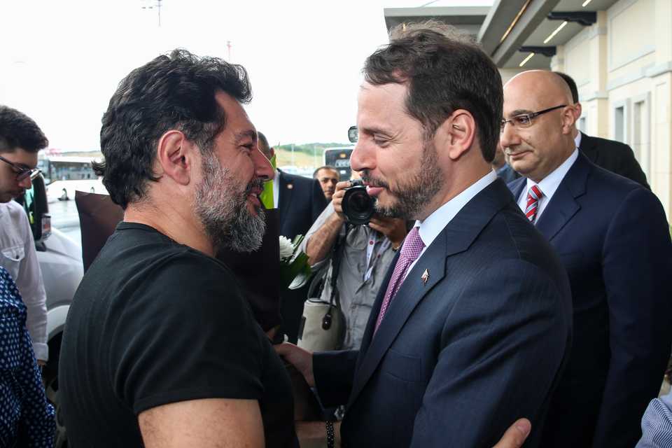Former Halkbank executive vice president Mehmet Hakan Atilla (L), found guilty in the US-Iranian sanctions case and released from US prison on Friday for good behaviour, welcomed by Turkey's Treasury and Finance Minister Berat Albayrak (R) at Istanbul Airport.