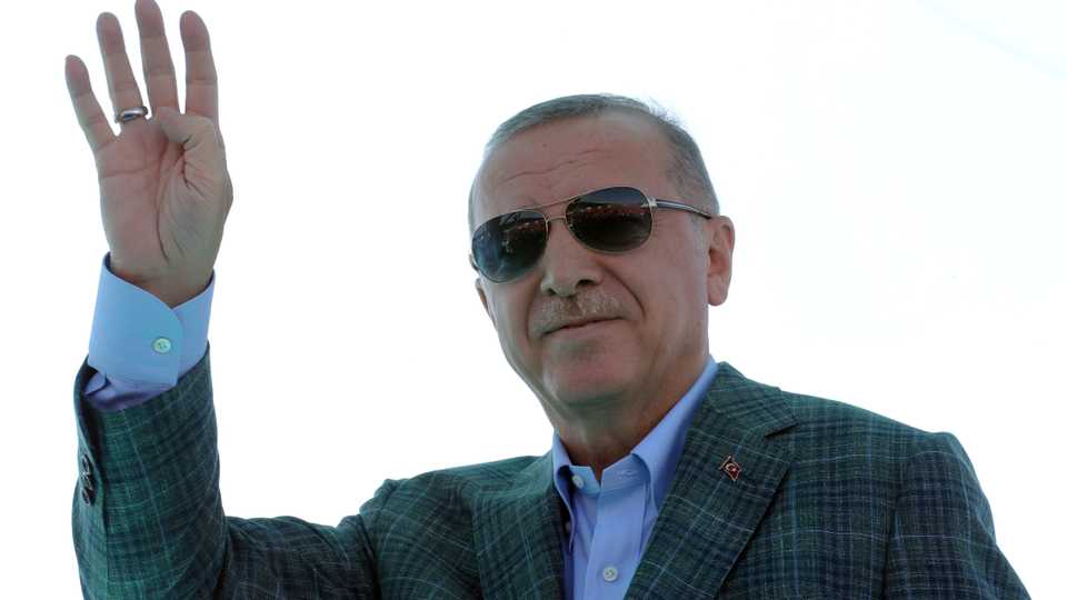 Turkish President Tayyip Erdogan greets his supporters during the opening ceremony of a highway in Bursa, Turkey, August 4, 2019.