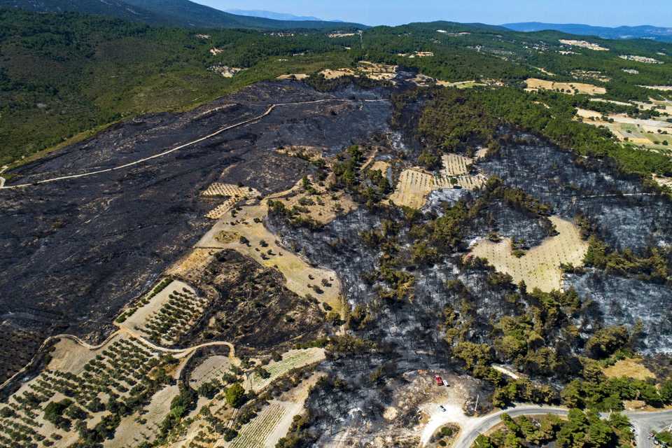 An aerial view of a burnt area after a fire that broke out in Izmir province of Aegean Turkey on August 19, 2019. The fire started in Karabaglar district and spread to Menderes, Seferihisar and Urla districts.