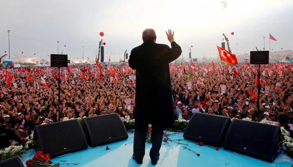 Tens of thousands waved red and white crescent moon Turkish flags in a show of support for the Turkish president.