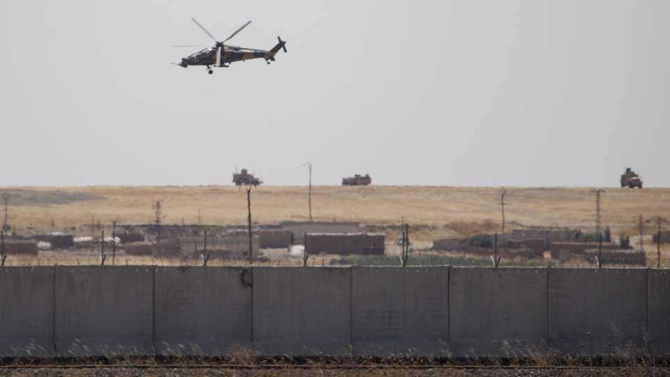 A photo taken from Turkey's Sanliurfa province shows the armoured vehicles and helicopters as Turkey, US start first joint ground patrols as part of efforts to establish safe zone east of Euphrates in Syria on September 08, 2019.