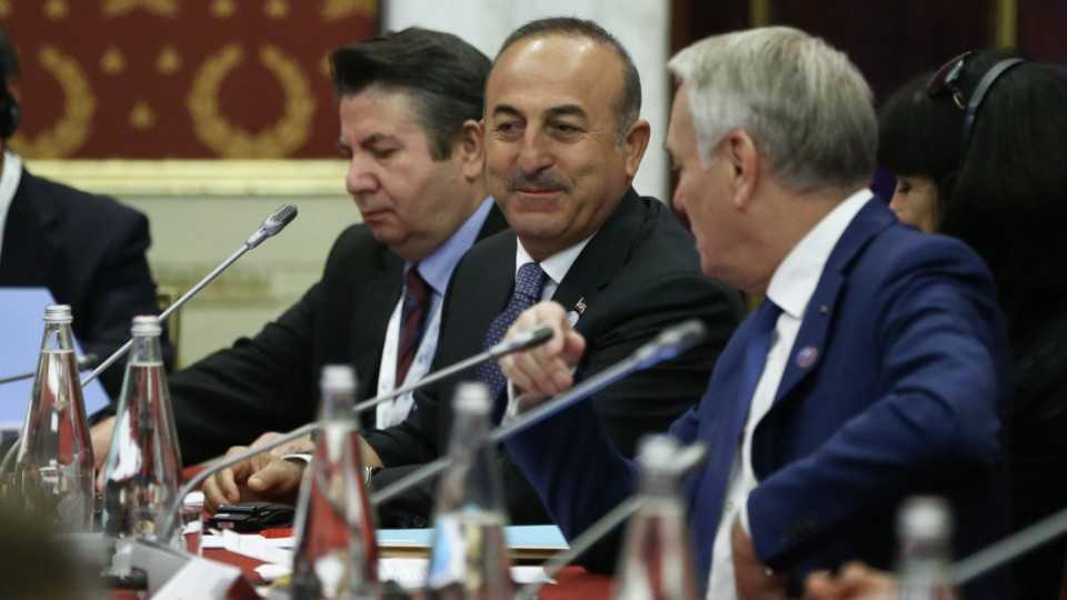 Turkish Foreign Minister Mevlut Cavusoglu (C) attends a session on Syria at the G7 meeting of foreign ministers in Lucca, Italy, on April 11, 2017.