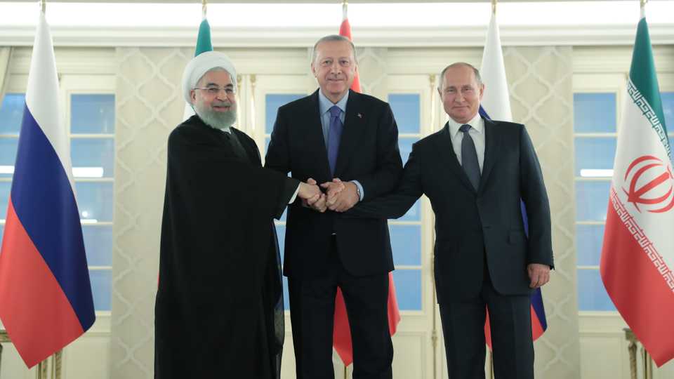 President of Turkey Recep Tayyip Erdogan (C), President of Russia Vladimir Putin (R) and President of Iran Hassan Rouhani (L) pose for a photo ahead of the Turkey-Russia-Iran trilateral summit at Cankaya Mansion in Ankara, Turkey on September 16, 2019.