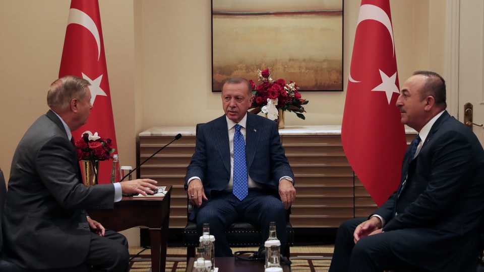 President of Turkey, Recep Tayyip Erdogan (C) receives US Senator, Lindsey Graham (L) in New York, United States on September 22, 2019. Minister of Foreign Affairs of Turkey, Mevlut Cavusoglu (R) also attended the meeting.