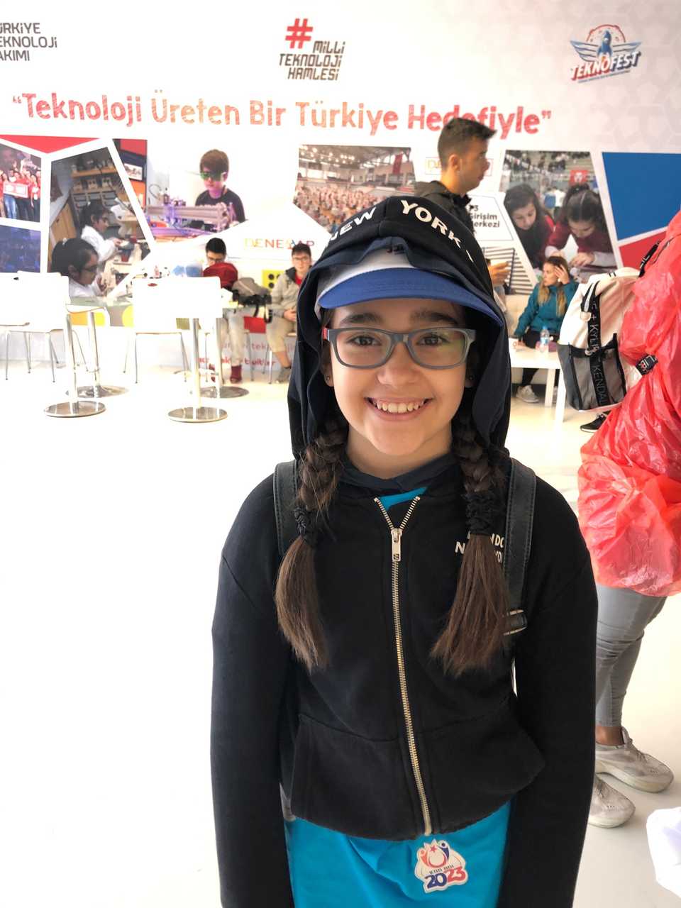 Neva Oden was visiting Teknofest from Edirne’s Efkan Yildirim middle school. The sign behind her says “Our goal is a Turkey that produces technology”.
