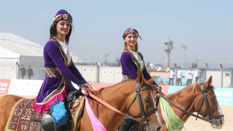 In this photograph taken on October 3, 2019, two women can be on horseback at the Ethnosport Culture Festival at Istanbul's Ataturk Airport on Thursday.