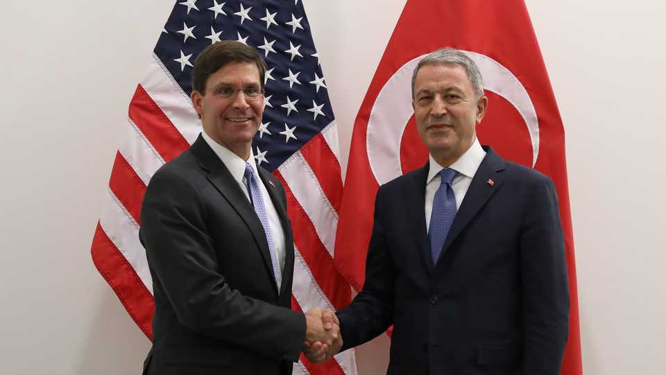 Turkish Defense Minister Hulusi Akar and his US counterpart Mark Esper pose during a Nato meeting of NATO Ministers of Defence in Brussel, Belgium on June 26, 2019.