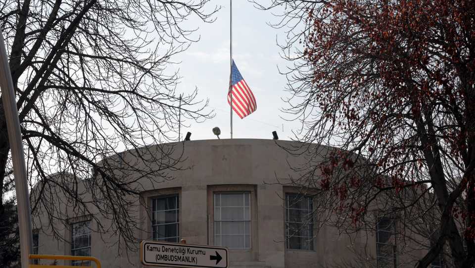 The US embassy's flag flies at half-mast in Ankara, Turkey, Monday, February 19, 2018.