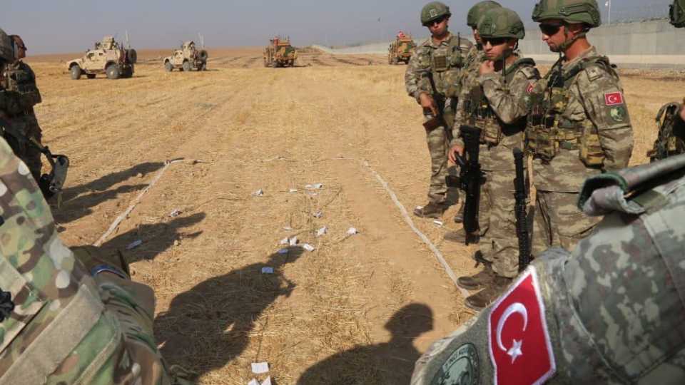 Turkish troops conduct their third joint ground patrol with US troops within a planned safe zone in northern Syria, along the Syrian-Turkish border in Tell Abyad, Syria on October 04, 2019.
