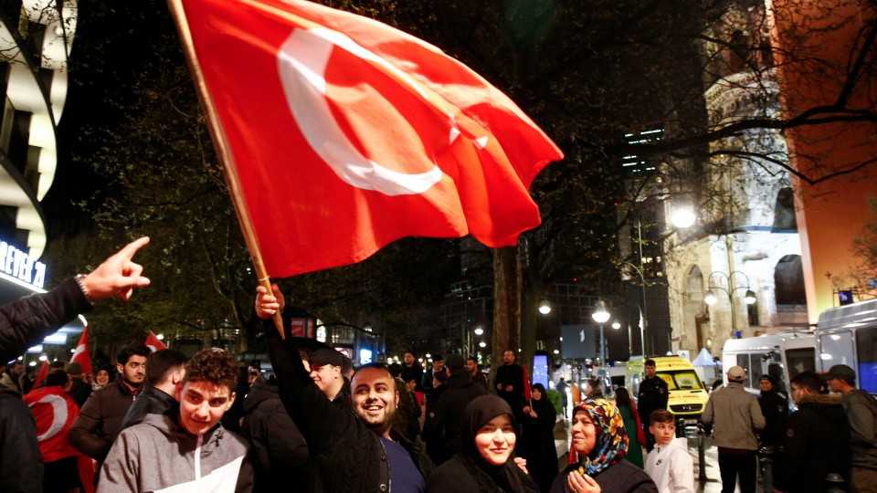 German Turks celebrate on Kurfuerstendamm boulevard in Berlin after the referendum result on Sunday on April 16.