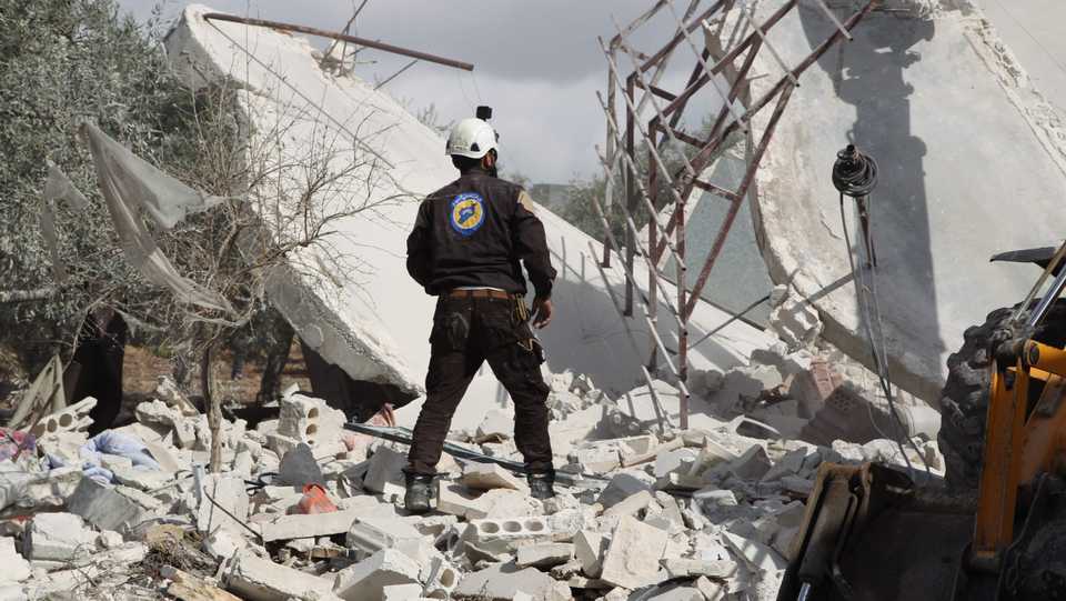A member of the Syrian Civil Defence (White Helmets) takes part in a search for victims of a Russian air strike that hit the village of Jabala in the south of the Idlib region on November 2, 2019.