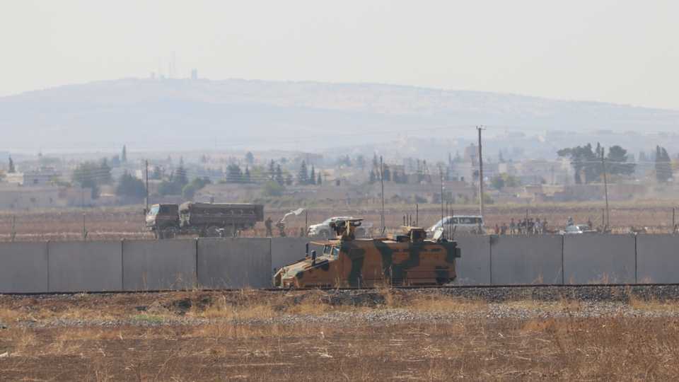 A photo taken from Sanliurfa on Turkey's border shows Turkish and Russian troops gathering in northern Syria on November 5, 2019.