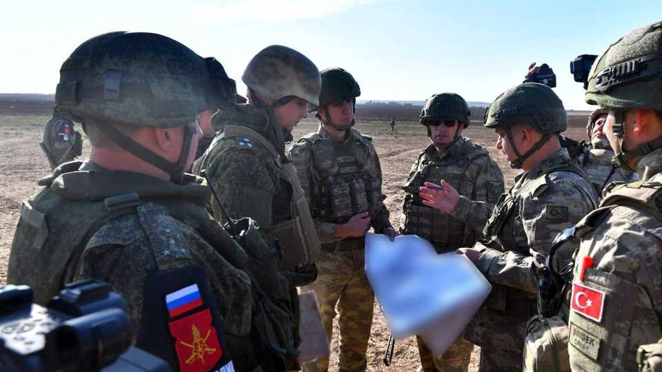 Turkish and Russian troops carry out the 10th joint ground patrols in the east of Euphrates, in Syria's Ras Al Ayn on November 23, 2019.