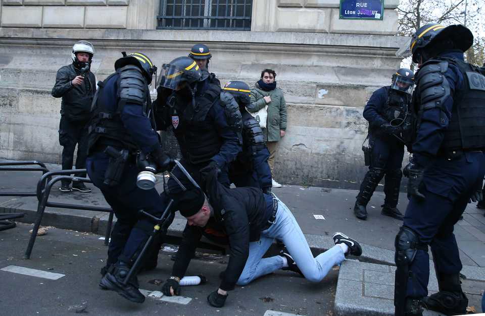 Security forces take protesters into custody during a general strike over French government's plan to overhaul the country's retirement system, in Paris, France on December 05, 2019.
