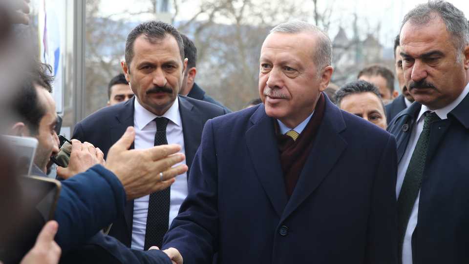 President of Turkey Recep Tayyip Erdogan greets Turkish citizens following his arrival in Geneva to attend 1st Global Refugee Forum in Switzerland on December 16, 2019