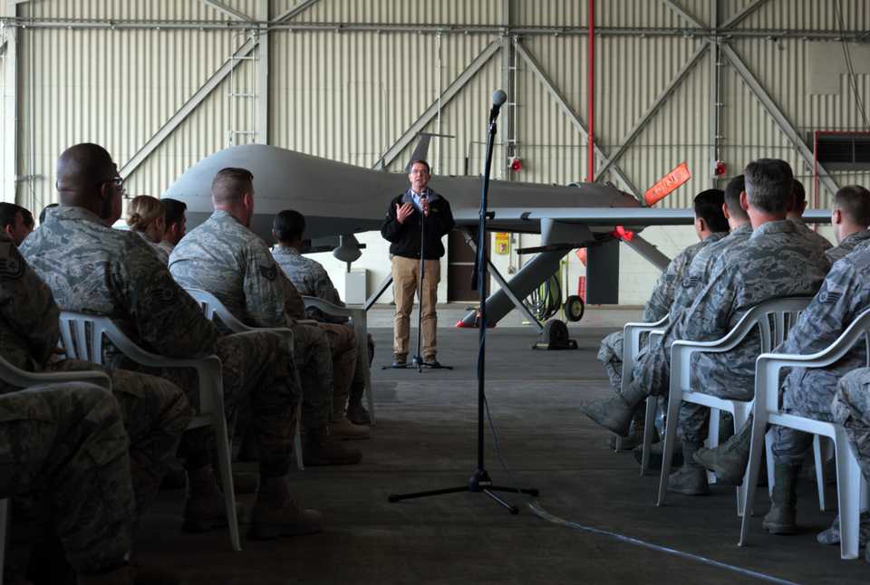 US Defense Secretary Ash Carter addresses the American troops as he stands in front of a drone at the Incirlik Air Base near Adana, Turkey on Dec. 15, 2015.