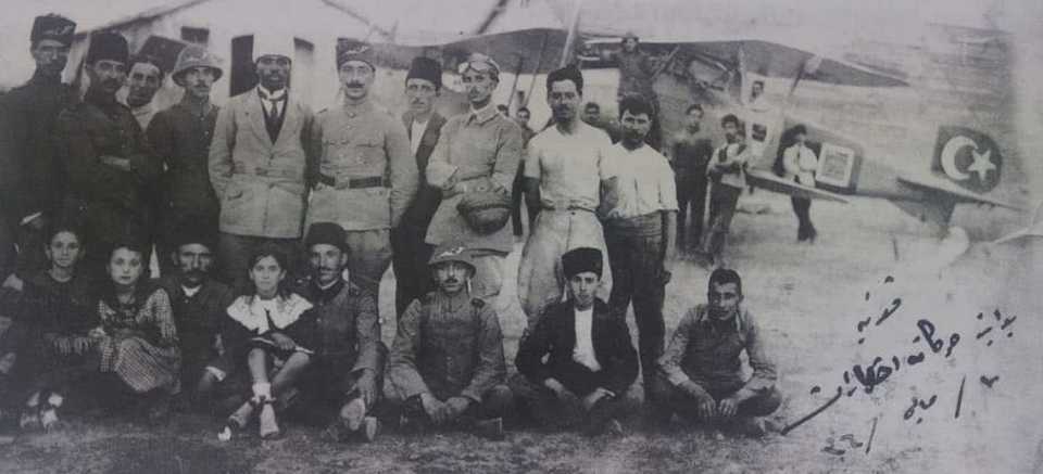 Ahmet Ali Celikten wearing a white headgear next to his fellow fighter pilots at Konya Aircraft Station on 7 May 1920, the year when the Turkish War of Independence was at its peak.