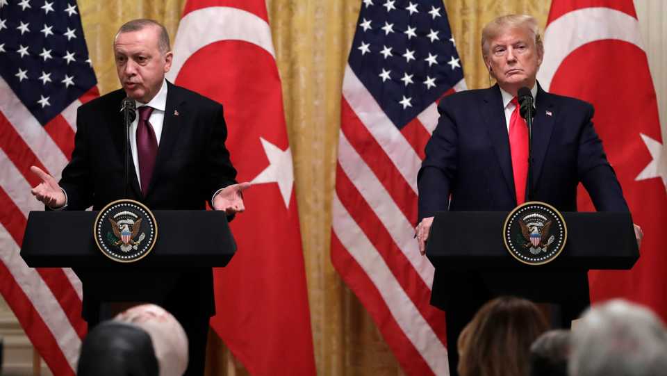 President Donald Trump listens as Turkish President Recep Tayyip Erdogan speaks during a news conference in the East Room of the White House, Wednesday, Nov. 13, 2019, in Washington.