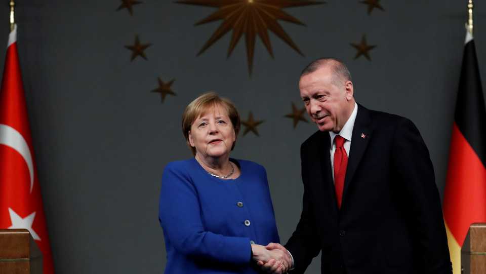 Turkey's President Erdogan and German Chancellor Merkel shake hands after a joint news conference in Istanbul, Turkey, January 24, 2020.