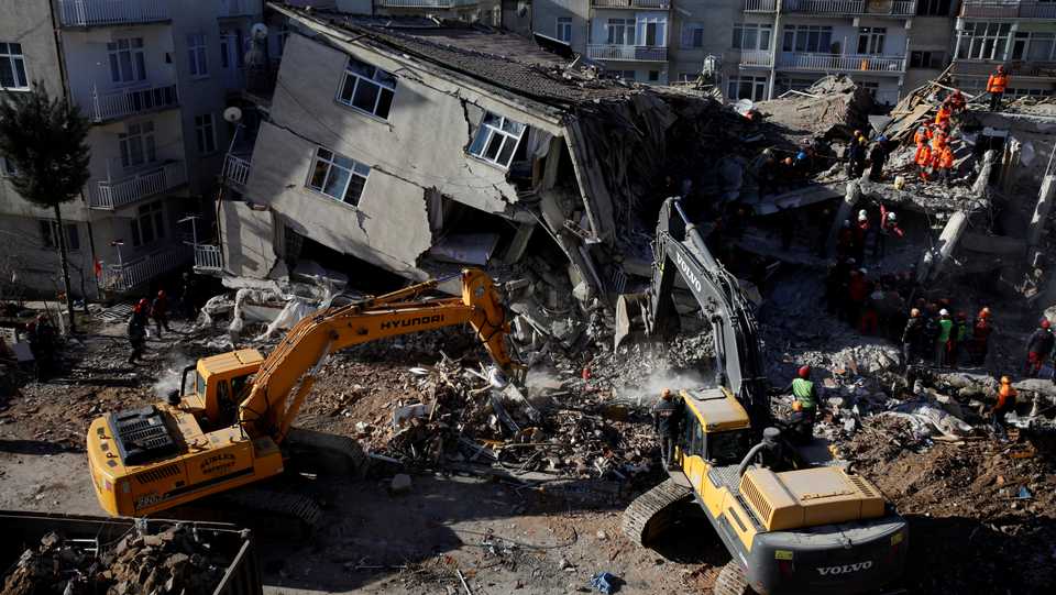 Rescue workers search the site of a collapsed building, after an earthquake in Elazig, Turkey on January 26, 2020.