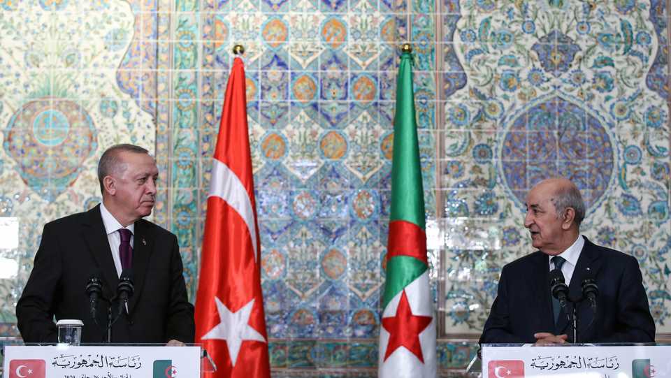 A handout picture taken and released on January 26, 2020 by the Turkish Presidential Press service shows Turkish President Recep Tayyip Erdogan (L) and Algerian President Abdelmadjid Tebboune (R) as they hold a joint press conference following their meeting at the Presidential Office in Algiers.