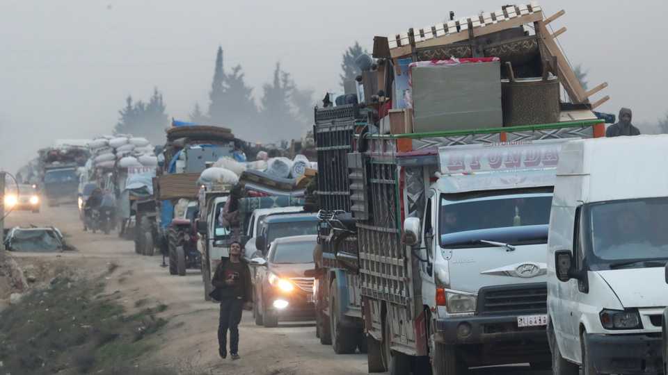 A view of trucks carrying belongings of displaced Syrians is pictured in the town of Sarmada in Idlib province, Syria. January 28, 2020.