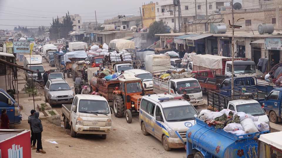 Syrian families who are being forcibly displaced due to the ongoing attacks carried out by Assad regime and its allies are on their way to safer zones with their belongings near Turkish border, in Idlib, Syria on February 4, 2020.