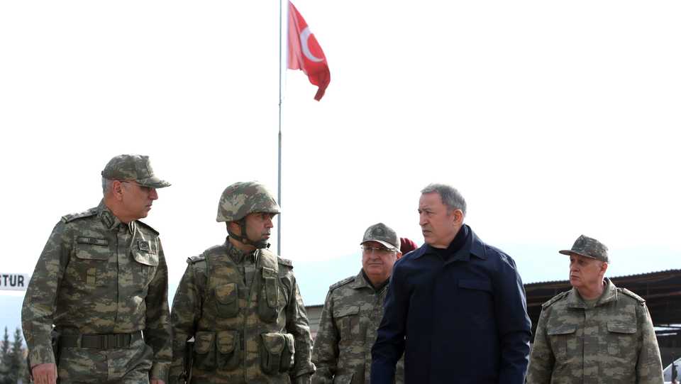 Turkey's National Defence Minister Hulusi Akar, second right, and Turkish army's top commanders arrive to inspect troops at the border with Syria, in Hatay, Turkey, Monday, February 3, 2020.