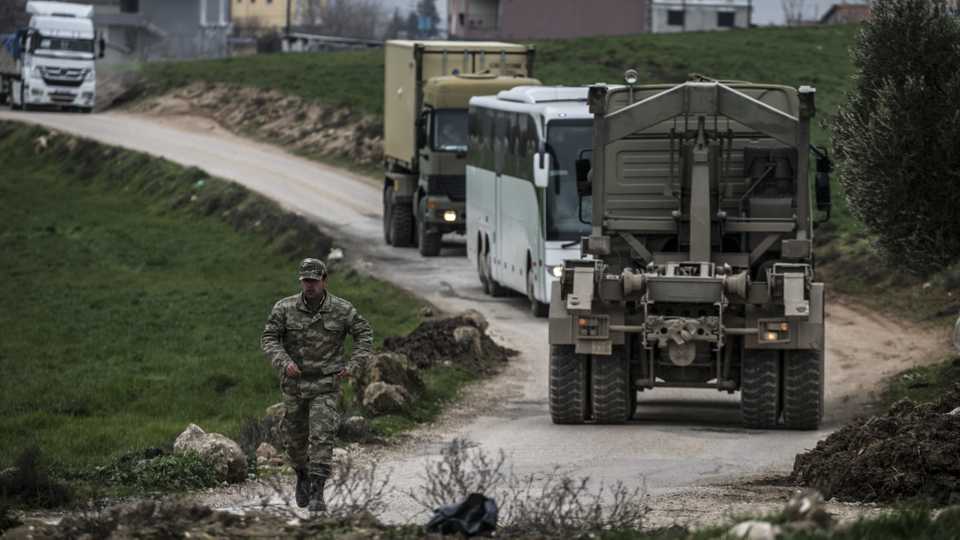 A convoy of Turkish Armed Forces' armoured vehicles arrives in Reyhanli district on its way to the Syrian border to support the military units deployed at the border, on February 11, 2020, in Hatay, Turkey.