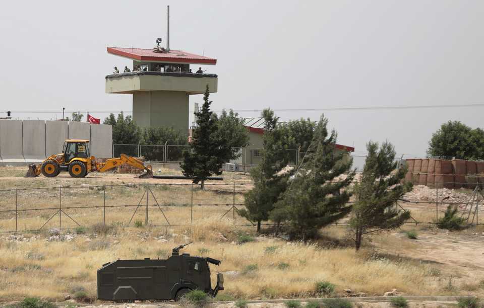 Turkish soldiers stand on a watch tower at the Atmeh crossing on the Syrian-Turkish border, as seen from the Syrian side, in Idlib governorate, Syria May 31, 2019.