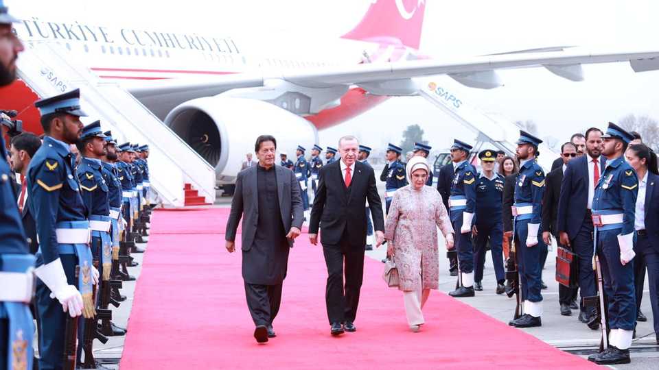 Pakistan's Prime Minister Imran Khan walks with Turkish President Tayyip Erdogan on his arrival in Islamabad, Pakistan, February 13, 2020.